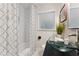 Bathroom featuring a modern sink, updated fixtures, and a tub with shower at 3263 Dodson Dr, Atlanta, GA 30344