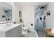 Modern bathroom with tiled shower, rainfall shower head, and wood bench at 3263 Dodson Dr, Atlanta, GA 30344