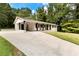 Front exterior of white brick ranch home with covered parking and tidy landscaping at 3263 Dodson Dr, Atlanta, GA 30344