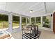 Bright sunroom with walls of windows overlooking the outdoor garden at 3263 Dodson Dr, Atlanta, GA 30344