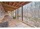 View of the backyard patio featuring a seating area and wooded backdrop for outdoor enjoyment at 7295 Hickory Bluff Dr, Cumming, GA 30040