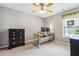 Bedroom with a ceiling fan and a desk with monitors at 7295 Hickory Bluff Dr, Cumming, GA 30040