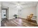 Finished basement bedroom with wood-look floors and a traditional rocking chair at 7295 Hickory Bluff Dr, Cumming, GA 30040