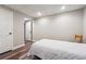 Comfortable bedroom featuring a doorway, closet, fresh paint, and stylish wood-look flooring at 7295 Hickory Bluff Dr, Cumming, GA 30040