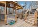 Spacious outdoor deck area showcasing the covered BBQ and stairs leading to another deck at 7295 Hickory Bluff Dr, Cumming, GA 30040