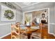 Inviting dining area featuring a round table, hardwood floors, and warm, neutral décor at 7295 Hickory Bluff Dr, Cumming, GA 30040