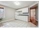 Cozy kitchen featuring white cabinets, a double sink, and sleek dark countertops at 7295 Hickory Bluff Dr, Cumming, GA 30040