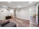 Finished basement living room features wood-look floors and recessed lighting at 7295 Hickory Bluff Dr, Cumming, GA 30040