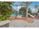 Community playground with swings and climbing structure near a tennis court at 7295 Hickory Bluff Dr, Cumming, GA 30040