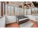 Relaxing screened porch with ceiling fan, comfortable seating, and scenic views at 7295 Hickory Bluff Dr, Cumming, GA 30040