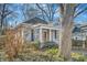 A charming single-story home with traditional architecture and mature trees surrounding the property at 959 Glen Arden Ne Way, Atlanta, GA 30306