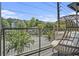 Relax on the balcony with hanging chair and treetop views of surrounding neighborhood at 1145 Kirkwood Se Ave # 4, Atlanta, GA 30316