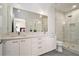 Bright bathroom with a double vanity, large mirror and glass enclosed shower at 1145 Kirkwood Se Ave # 4, Atlanta, GA 30316