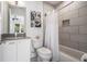 Clean and modern bathroom featuring a shower/tub combination, gray tile and updated fixtures at 1145 Kirkwood Se Ave # 4, Atlanta, GA 30316