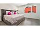Elegant bedroom with a tufted headboard, luxury bedding and gray wood flooring at 1145 Kirkwood Se Ave # 4, Atlanta, GA 30316