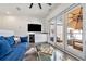 Bonus room leading to a sun-soaked patio with a sleek sectional sofa at 1145 Kirkwood Se Ave # 4, Atlanta, GA 30316