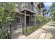 Modern townhome exterior with brick accents, a small balcony, and wrought iron fence at 1145 Kirkwood Se Ave # 4, Atlanta, GA 30316