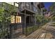 Charming townhome boasts a gated front yard, with a private balcony, and lush landscaping at 1145 Kirkwood Se Ave # 4, Atlanta, GA 30316