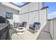 Private patio is perfect for entertaining with cozy seating around fire pit at 1145 Kirkwood Se Ave # 4, Atlanta, GA 30316