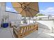 Inviting rooftop patio with comfortable seating, umbrella, and modern fire pit feature, perfect for outdoor relaxation at 1145 Kirkwood Se Ave # 4, Atlanta, GA 30316