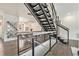 Modern staircase with metal railings leading to the upper level, offering an open concept design at 1145 Kirkwood Se Ave # 4, Atlanta, GA 30316