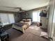 Bedroom featuring natural lighting, ceiling fan, and neutral-toned walls, offering a calming atmosphere at 1554 Circlestone Dr, Stone Mountain, GA 30088