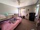 Cozy bedroom with twin beds, ceiling fan, large mirror, and light-colored walls at 1554 Circlestone Dr, Stone Mountain, GA 30088