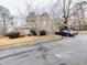 Large, paved driveway with ample parking space for multiple vehicles in a well-maintained landscape at 1554 Circlestone Dr, Stone Mountain, GA 30088