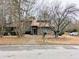 Charming brick home with a well-maintained lawn and mature trees in a quiet neighborhood at 1554 Circlestone Dr, Stone Mountain, GA 30088