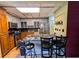 Well-appointed kitchen with a kitchen island with seating and stainless steel appliances and tile floors at 1554 Circlestone Dr, Stone Mountain, GA 30088