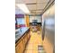 Bright kitchen featuring stainless steel appliances, wooden cabinets, and a stylish tiled floor at 1554 Circlestone Dr, Stone Mountain, GA 30088
