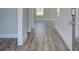 Inviting entryway features stylish wood-look flooring, neutral walls, and a glimpse into the home's interior at 706 Bristol Dr, Loganville, GA 30052
