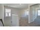 Upstairs hallway with plush carpeting, neutral walls, and well-lit design at 706 Bristol Dr, Loganville, GA 30052