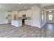 Modern kitchen with stainless steel appliances, white cabinets, and granite countertops at 706 Bristol Dr, Loganville, GA 30052