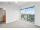 Bedroom with carpet, large window with a view, and bathroom entrance at 361 17Th Nw St # 922, Atlanta, GA 30363