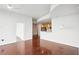 Open-concept living room with dark hardwood floors adjacent to the kitchen area at 361 17Th Nw St # 922, Atlanta, GA 30363