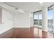 Spacious living room with hardwood floors and sliding glass doors to balcony at 361 17Th Nw St # 922, Atlanta, GA 30363
