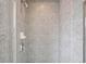 Neutral tiled shower with adjustable showerhead and built-in soap dish at 361 17Th Nw St # 922, Atlanta, GA 30363