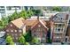 Charming building with terracotta roof tiles, surrounded by lush greenery in a vibrant urban setting at 93 Peachtree Ne Pl # 5, Atlanta, GA 30309