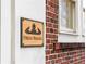 Elegant Phelan Building sign displayed against a brick exterior with a window at 93 Peachtree Ne Pl # 5, Atlanta, GA 30309