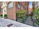 Charming brick building with manicured landscaping and wrought iron fencing for an inviting entrance at 93 Peachtree Ne Pl # 5, Atlanta, GA 30309