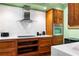 This kitchen is equipped with stainless steel appliances, wood cabinets, and modern finishes, perfect for culinary enthusiasts at 93 Peachtree Ne Pl # 5, Atlanta, GA 30309