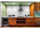 A contemporary kitchen features a stainless steel range hood, gas cooktop, and ample counter space for food preparation at 93 Peachtree Ne Pl # 5, Atlanta, GA 30309
