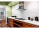 The kitchen features a gas cooktop, stainless steel appliances, and wood cabinetry, blending style and functionality at 93 Peachtree Ne Pl # 5, Atlanta, GA 30309