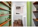 Bright laundry room with with shelving and laundry equipment at 93 Peachtree Ne Pl # 5, Atlanta, GA 30309