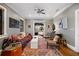 Eclectic living room with patterned rug, sofa, and curated art providing a cozy and stylish space at 93 Peachtree Ne Pl # 5, Atlanta, GA 30309