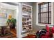Stylish home interior featuring a built-in bookshelf, hardwood floors, and an inviting atmosphere at 93 Peachtree Ne Pl # 5, Atlanta, GA 30309