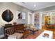Inviting living space with hardwood floors, decorative furniture, and view into the dining room at 93 Peachtree Ne Pl # 5, Atlanta, GA 30309