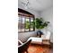 Bright sunroom with a chaise lounge, large window, and vibrant decor for a serene atmosphere at 93 Peachtree Ne Pl # 5, Atlanta, GA 30309