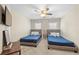 Bright bedroom with two twin beds, TV and wooden table at 4085 Creekview Ridge Dr, Buford, GA 30518